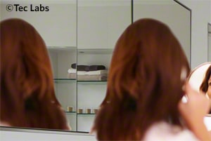 Woman facing the mirror.